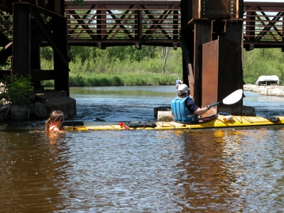 [Photo: Claire ONeill rescues a stuck paddler.]