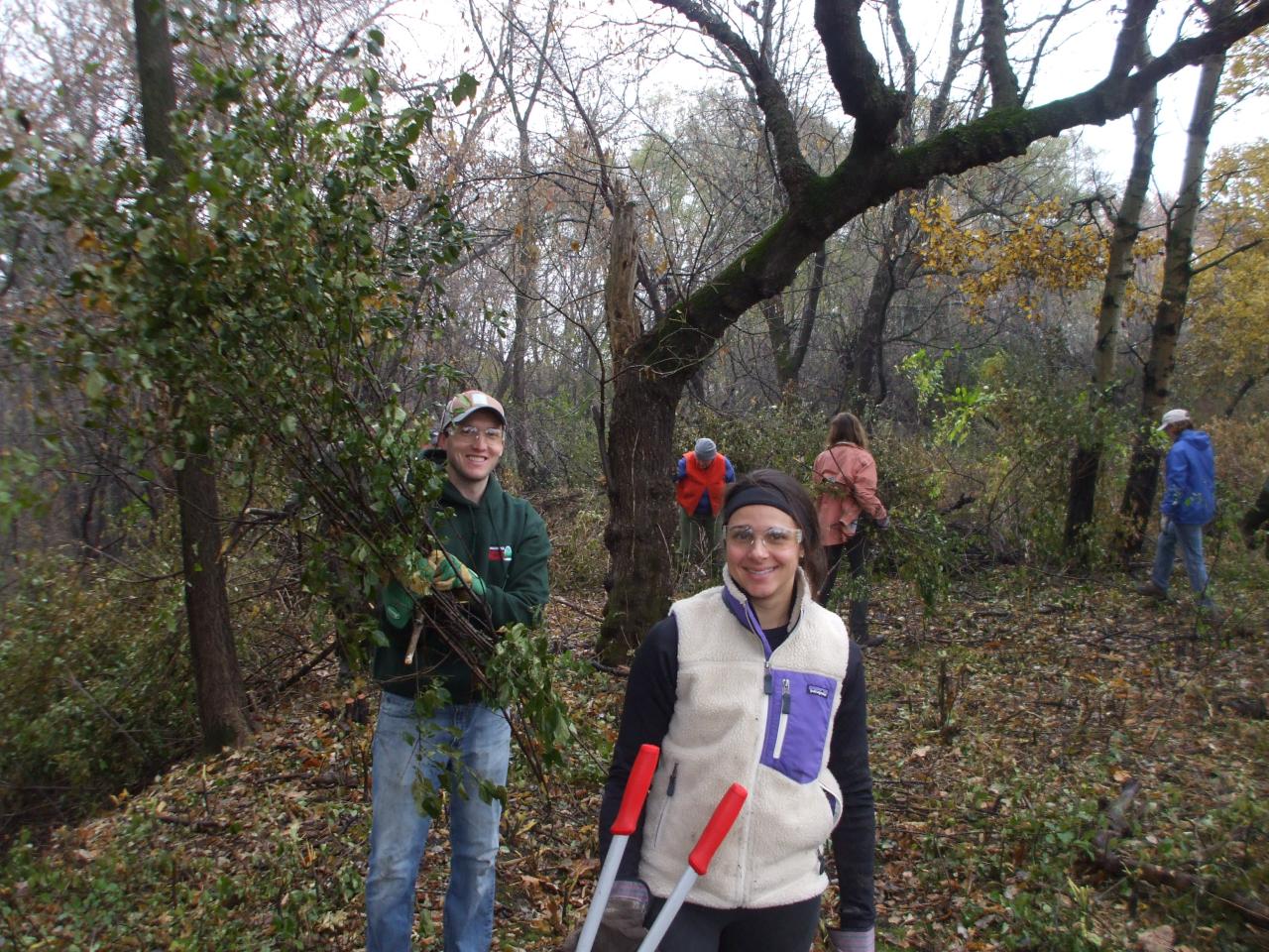 Volunteers hauling brush at last year's celebration