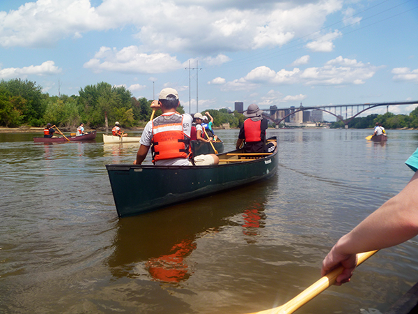 Youth Empowerment Program participants canoe the Mississippi