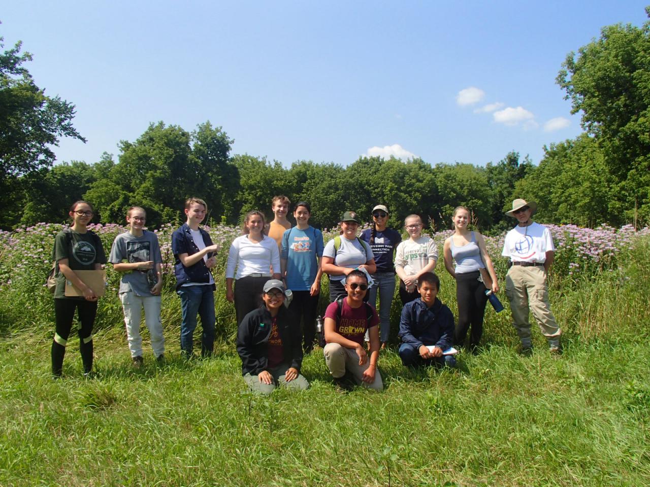 Youth Empowerment Program students and the National Park Service Fellows gather in a group at Vermilion Linear Park.